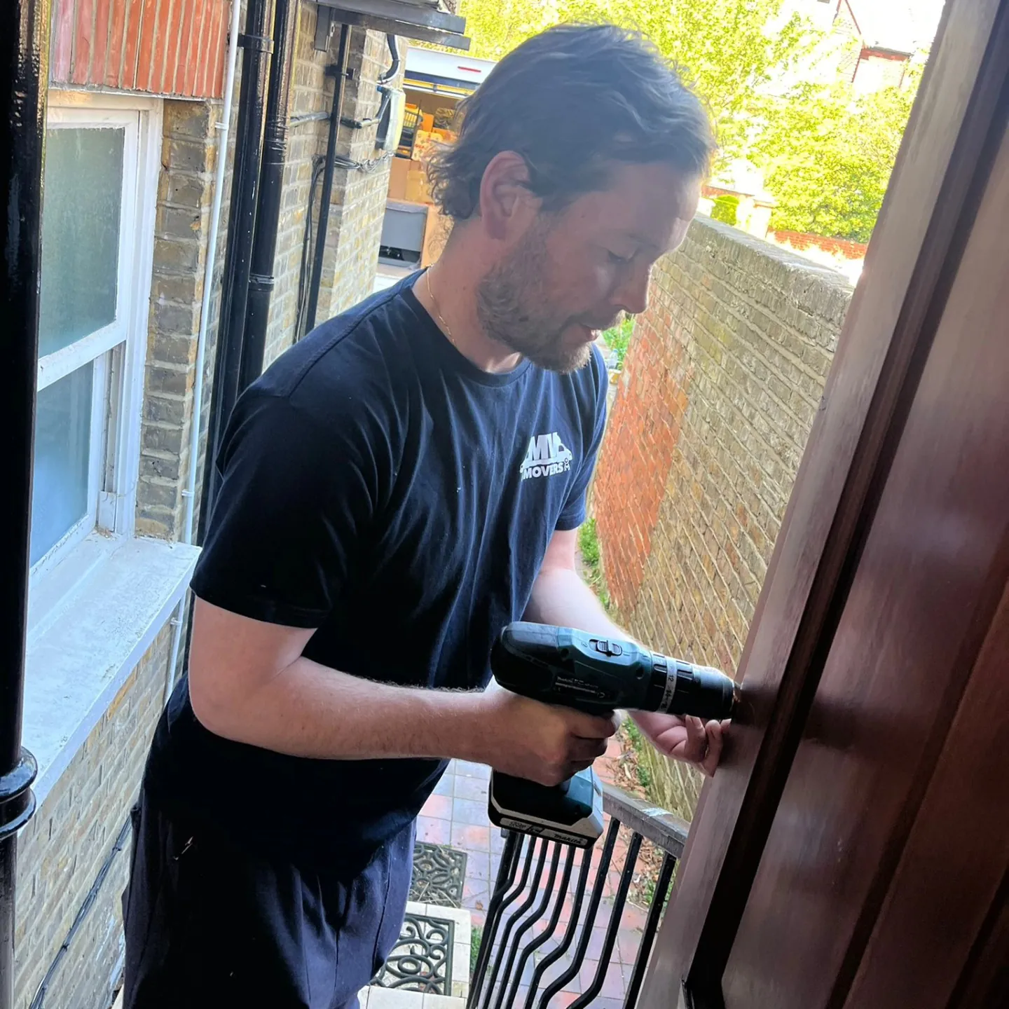 MV Movers crew member with a drill reassembling furniture – Furniture Assembly by Dave's MV Movers crew MV Movers crew member with a drill reassembling furniture – Furniture Assembly by Dave's MV Movers crew
