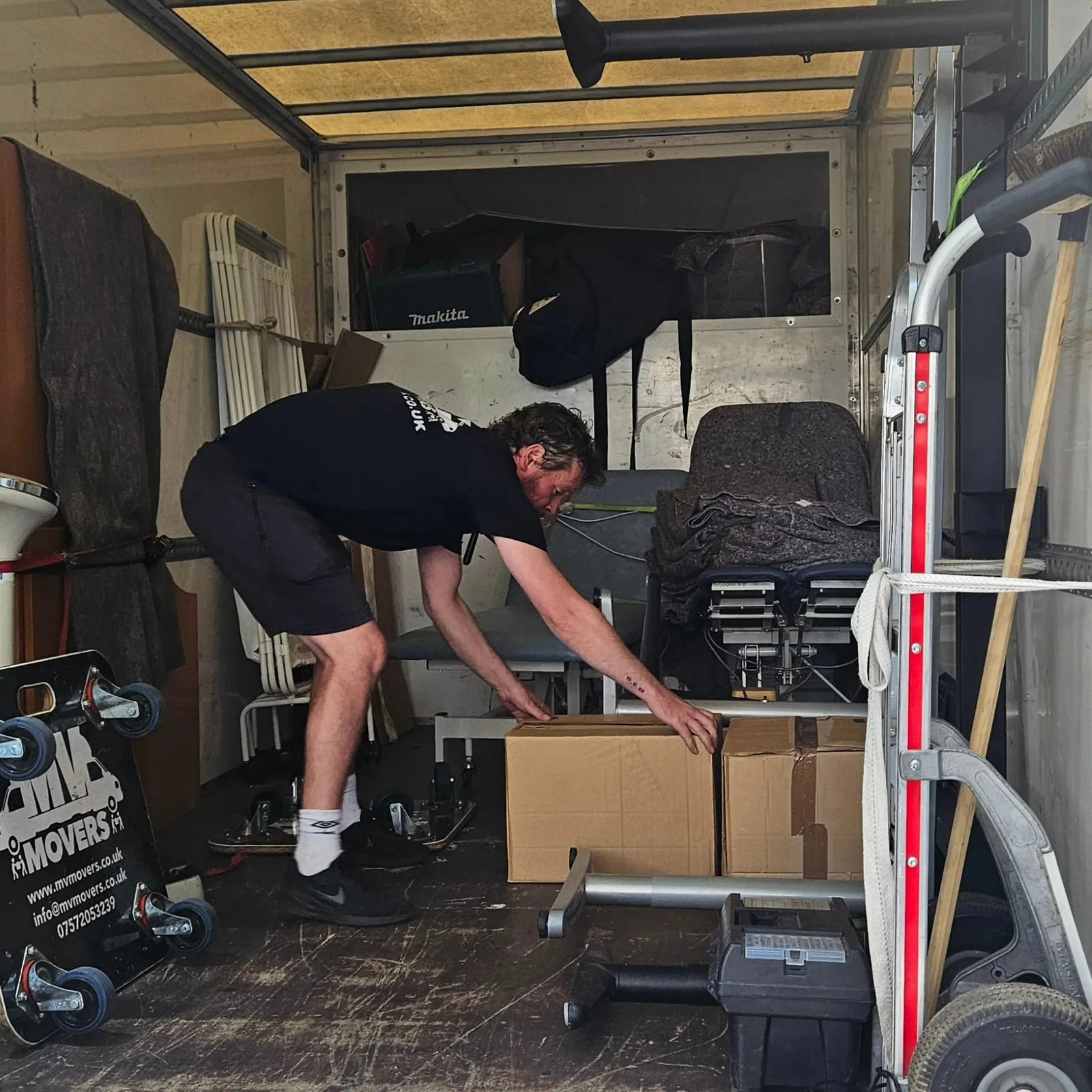 Loaded and strapped – Blankets first, straps second – MV Movers